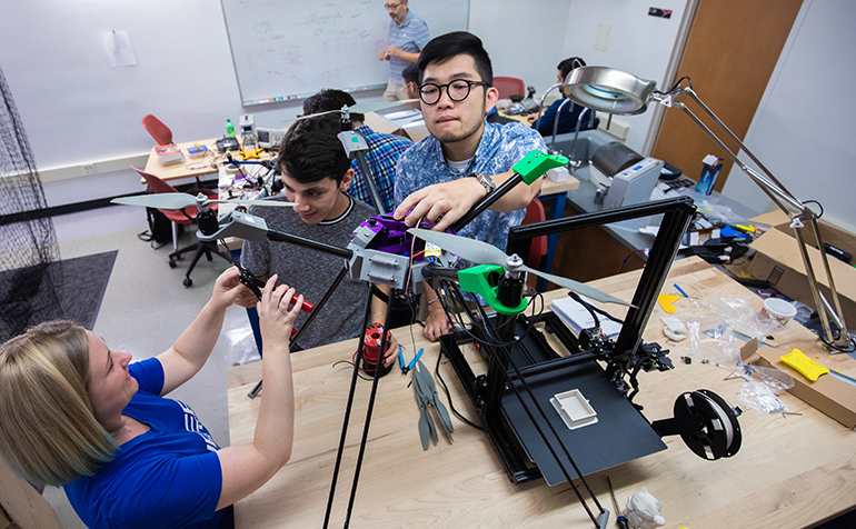 Students work on drone